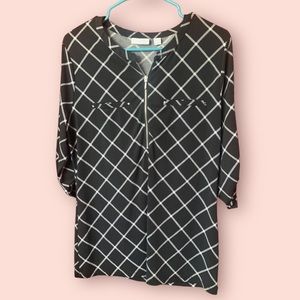 L black and white blouse with half length zipper.